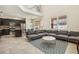 Spacious living area featuring tile flooring, modern furniture, and an abundance of natural light at 2551 Dharma Cir, Kissimmee, FL 34746
