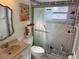 Updated bathroom showcasing a vanity sink, toilet, and walk-in shower with patterned tile; ideal for guests and Gathering at 281 San Gabriel St, Winter Springs, FL 32708