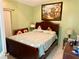 Serene bedroom featuring a plush bed, a wooden frame, and a large window; perfect for relaxation and rejuvenation at 281 San Gabriel St, Winter Springs, FL 32708
