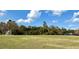 Expansive grassy field with goal posts, backed by lush trees, perfect for recreation at 281 San Gabriel St, Winter Springs, FL 32708