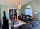 Inviting living room featuring neutral walls, tile floors, and elegant chandelier, perfect for relaxing or entertaining guests at 281 San Gabriel St, Winter Springs, FL 32708