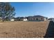 Backyard view of newly built homes, each featuring a spacious yard area at 325 Marion Oaks Trail, Ocala, FL 34473