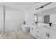 Modern bathroom boasting a soaking tub, double vanity, and sleek black fixtures at 325 Marion Oaks Trail, Ocala, FL 34473