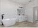Elegant bathroom showcasing a soaking tub, double sink vanity, and contemporary finishes at 325 Marion Oaks Trail, Ocala, FL 34473