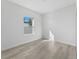 Minimalist bedroom with ample natural light, neutral walls, and modern flooring at 325 Marion Oaks Trail, Ocala, FL 34473