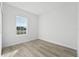 Well-lit bedroom with a large window and light-colored flooring, creating a bright, airy space at 325 Marion Oaks Trail, Ocala, FL 34473