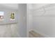 View from hallway of bedroom with exterior views and open closet at 325 Marion Oaks Trail, Ocala, FL 34473