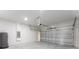 Spacious garage with concrete flooring, cinder block walls, and an automatic door at 325 Marion Oaks Trail, Ocala, FL 34473