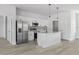 Modern kitchen with stainless steel appliances, island, and sleek cabinets, perfect for cooking at 325 Marion Oaks Trail, Ocala, FL 34473