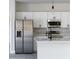 Modern kitchen with stainless steel appliances, ample cabinet space, and stylish finishes throughout at 325 Marion Oaks Trail, Ocala, FL 34473
