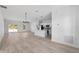 Bright and airy living space featuring sleek floors and an open layout to the kitchen at 325 Marion Oaks Trail, Ocala, FL 34473