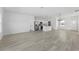 Open-concept space with abundant natural light and sleek floors, ideal for modern living at 325 Marion Oaks Trail, Ocala, FL 34473