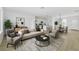 Open-concept living room with modern furnishings flowing into kitchen and dining areas at 325 Marion Oaks Trail, Ocala, FL 34473