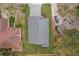 Aerial shot displaying the roof of the home, surrounded by mature trees and landscaping at 333 Bahia Cir, Longwood, FL 32750