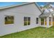 Exterior view showcasing the home's well-manicured backyard and covered patio at 333 Bahia Cir, Longwood, FL 32750