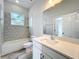 Bathroom features a hexagon tile, tub, and white quartz counter at 333 Bahia Cir, Longwood, FL 32750