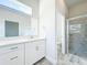 Modern bathroom boasts a sleek vanity with stone countertop, frameless shower, and a separate water closet at 333 Bahia Cir, Longwood, FL 32750