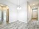 Dining room area with chandelier lighting and views into the living spaces at 333 Bahia Cir, Longwood, FL 32750