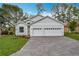 Charming single-story home featuring a three-car garage and brick-paved driveway at 333 Bahia Cir, Longwood, FL 32750