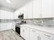 Close up view of a kitchen featuring new appliances, backsplash, and quartz countertops at 333 Bahia Cir, Longwood, FL 32750