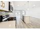 Open floor plan of kitchen overlooking living area with stainless steel appliances at 333 Bahia Cir, Longwood, FL 32750
