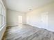 Spacious living room features stylish wood-look tile flooring and neutral paint, creating a bright and modern space at 333 Bahia Cir, Longwood, FL 32750