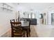 Bright dining room showcases a dark wood table and seating for six at 406 Sandbar Ave, Haines City, FL 33844