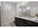 Bathroom with double sink vanity and granite countertops next to glass-door shower at 4157 Lana Ave, Davenport, FL 33897