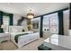 Stylized bedroom with decorative accent wall, modern chandelier and furniture at 4157 Lana Ave, Davenport, FL 33897
