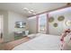 Well-lit bedroom featuring a desk and chair, and stylish decor at 4157 Lana Ave, Davenport, FL 33897