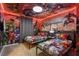 Avengers themed bedroom featuring custom superhero wall art, beds, and ambient lighting at 4157 Lana Ave, Davenport, FL 33897