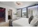 Modern bedroom with unique lighting, decor and view into a modern bathroom at 4157 Lana Ave, Davenport, FL 33897