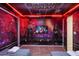 Guardians of the Galaxy themed bedroom featuring custom wall art, beds, and neon lighting at 4157 Lana Ave, Davenport, FL 33897