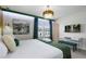 Bright bedroom featuring modern decor, luxury bed linens and decorative chandelier at 4157 Lana Ave, Davenport, FL 33897