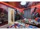 Avengers themed bedroom with custom superhero wall art, beds, and cool ambient lighting at 4157 Lana Ave, Davenport, FL 33897