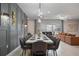 Elegant dining room with modern lighting, a large dining table, and stylish decor at 4157 Lana Ave, Davenport, FL 33897