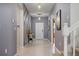Inviting foyer with decorative wall accents, neutral tile flooring, and stylish lighting at 4157 Lana Ave, Davenport, FL 33897