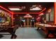 A game room has a foosball table, pool table, flat screen TV, and Minecraft theme decor at 4157 Lana Ave, Davenport, FL 33897