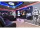 A Star Wars themed game room with a large television, movie-themed wall art, and comfortable seating at 4157 Lana Ave, Davenport, FL 33897