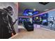 A Star Wars themed game room featuring an entertainment center and decorative wall designs at 4157 Lana Ave, Davenport, FL 33897