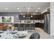 Open kitchen with stainless steel appliances, a granite countertop island, and bar stool seating at 4157 Lana Ave, Davenport, FL 33897