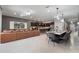 Spacious open floor plan combining living room, dining area, and kitchen with modern finishes at 4157 Lana Ave, Davenport, FL 33897