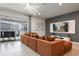 Cozy living room with modern lighting, sliding glass doors, and stylish sectional sofa at 4157 Lana Ave, Davenport, FL 33897