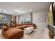 Comfortable living room with a large sectional sofa, sliding glass doors, and modern decor at 4157 Lana Ave, Davenport, FL 33897