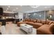 Spacious living space with modern finishes, a cozy sectional, and an open kitchen layout at 4157 Lana Ave, Davenport, FL 33897