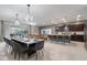 Open-concept living space featuring modern kitchen, dining area, and cozy living room at 4157 Lana Ave, Davenport, FL 33897