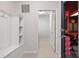 A home's mud room features neutral wall tones, tile flooring, and a practical built-in storage bench at 4157 Lana Ave, Davenport, FL 33897