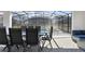 This outdoor dining area provides views of the pool and neighboring homes at 4157 Lana Ave, Davenport, FL 33897