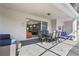An outdoor patio with a dining table, chairs, and an opening to the interior, and a view of the pool at 4157 Lana Ave, Davenport, FL 33897