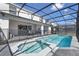 The screened-in pool and hot tub offer a relaxing outdoor space, perfect for enjoying sunny days and warm evenings at 4157 Lana Ave, Davenport, FL 33897